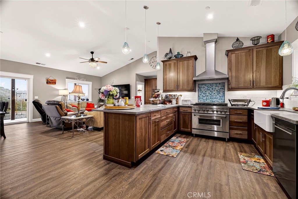 603 Zink Road Berry Creek, CA 95916 - Photo 18 of 69 a kitchen with stainless steel appliances a stove top oven and a refrigerator
