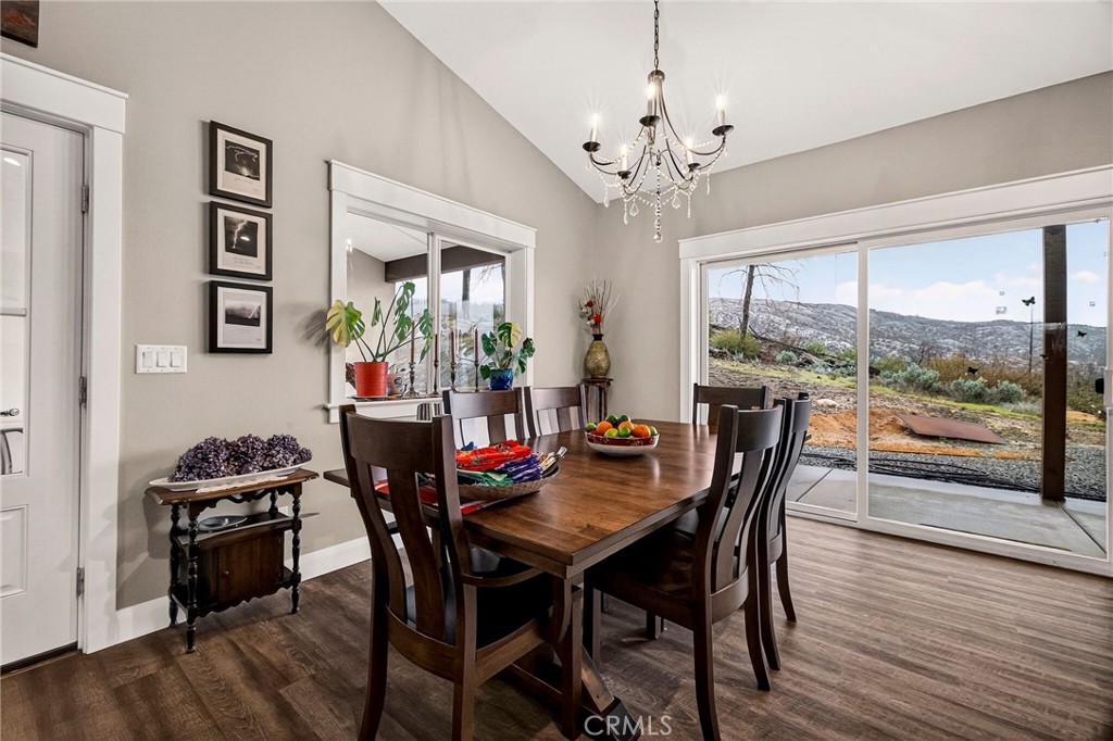 603 Zink Road Berry Creek, CA 95916 - Photo 23 of 69 a view of a dining room with furniture window and wooden floor