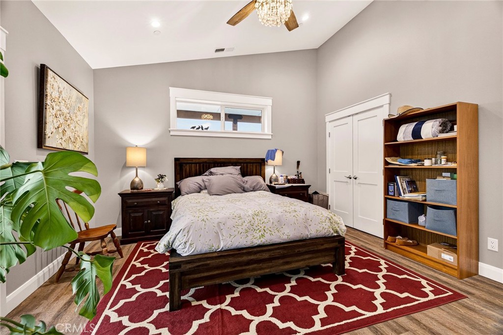 603 Zink Road Berry Creek, CA 95916 - Photo 27 of 69 a bedroom with a bed and a book shelf