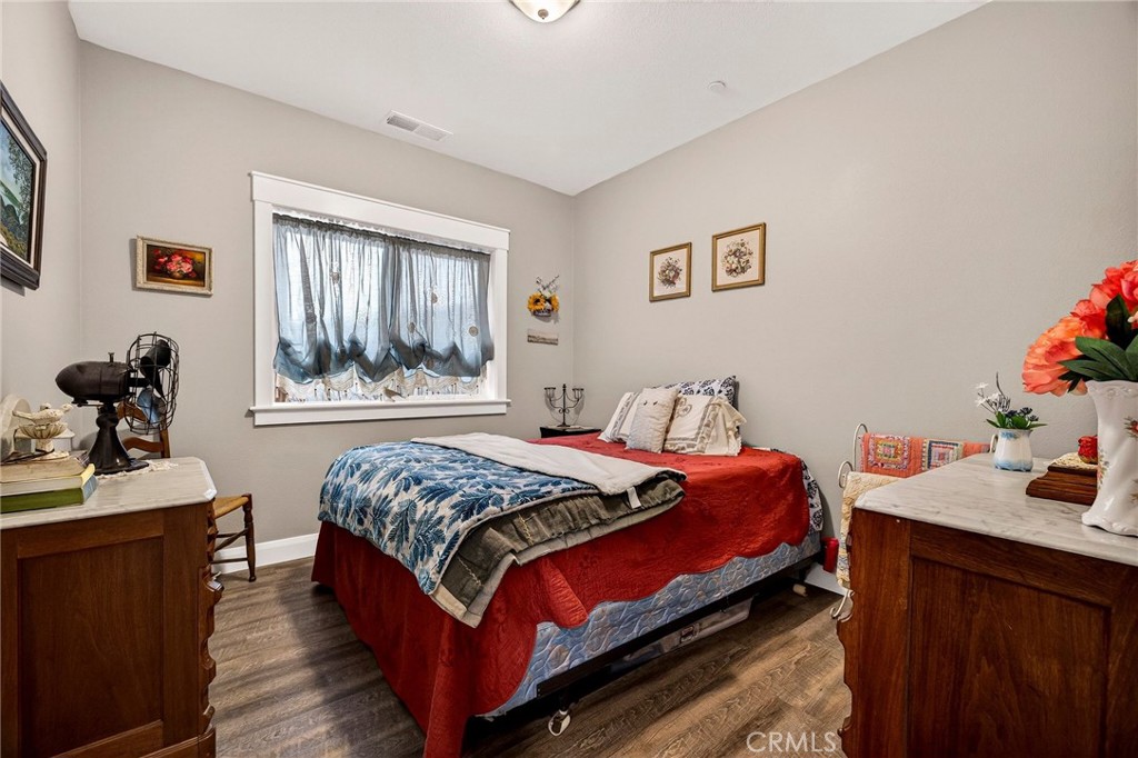 603 Zink Road Berry Creek, CA 95916 - Photo 35 of 69 a bedroom with a bed and a dresser