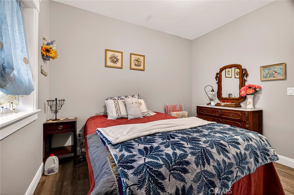 603 Zink Road Berry Creek, CA 95916 - Photo 36 of 69 a bedroom with a bed and a table in it