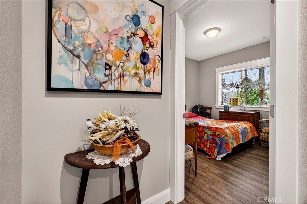 603 Zink Road Berry Creek, CA 95916 - Photo 42 of 69 a bed room with a bed and a painting on the wall