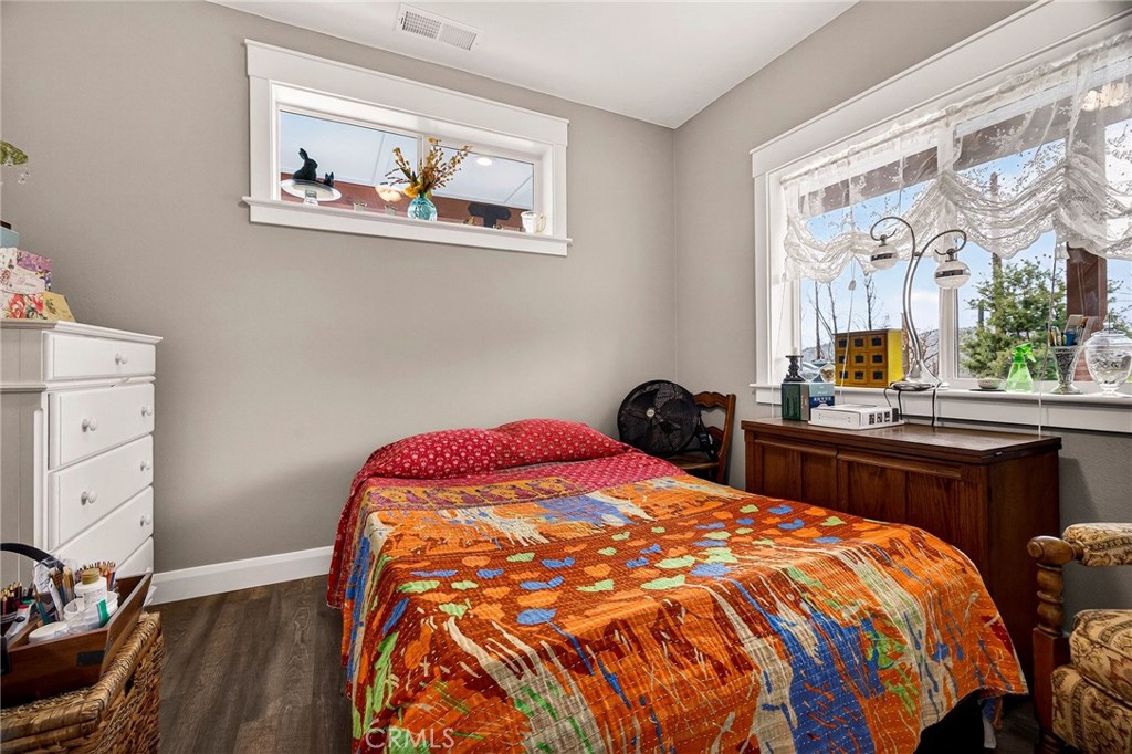 603 Zink Road Berry Creek, CA 95916 - Photo 45 of 69 a bed sitting in a bedroom next to a window with dresser