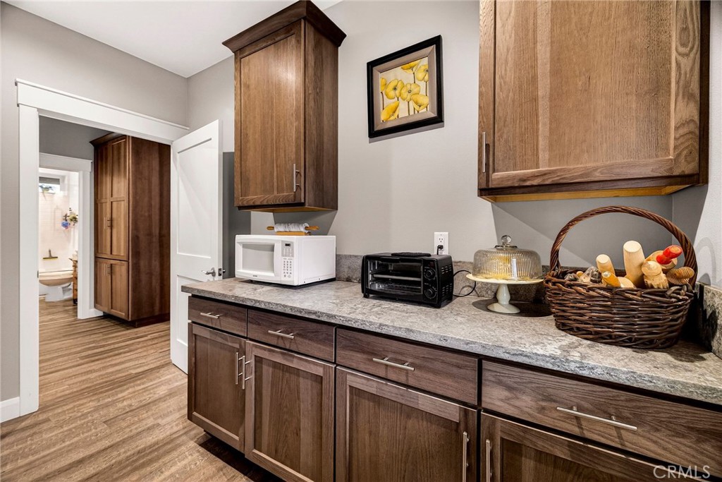 603 Zink Road Berry Creek, CA 95916 - Photo 49 of 69 a kitchen with stainless steel appliances granite countertop a stove a sink and a microwave