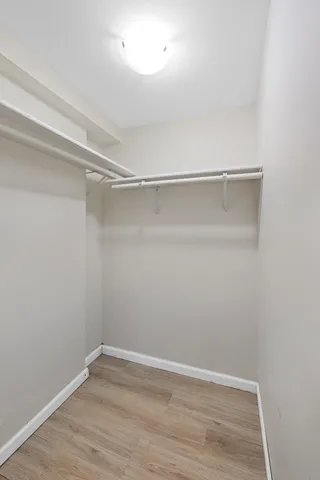 a view of an empty walk in closet