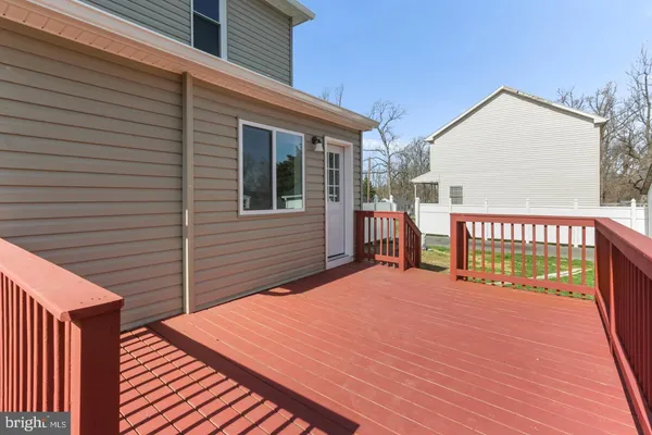 a view of a house with wooden deck