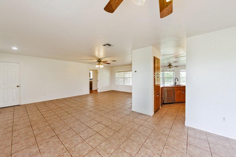 4316 Leona Road Bowie, TX 76230 - Photo 11 of 37 a view of a storage & utility room with two washing machine