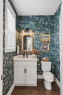 a bedroom with a bed closet and a flat tv screen