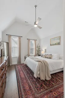 a bedroom with a bed and flat screen tv