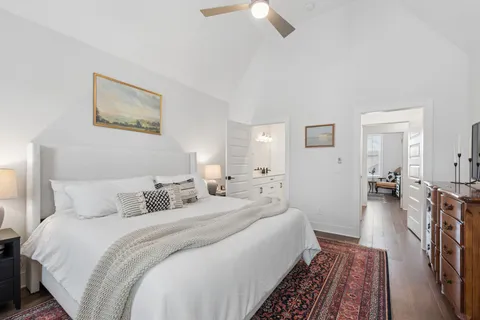a bathroom with a sink double vanity granite tub shower and a mirror