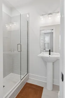 a bathroom with a shower and a toilet