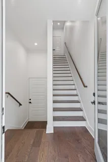 a living room with fireplace furniture and a wooden floor