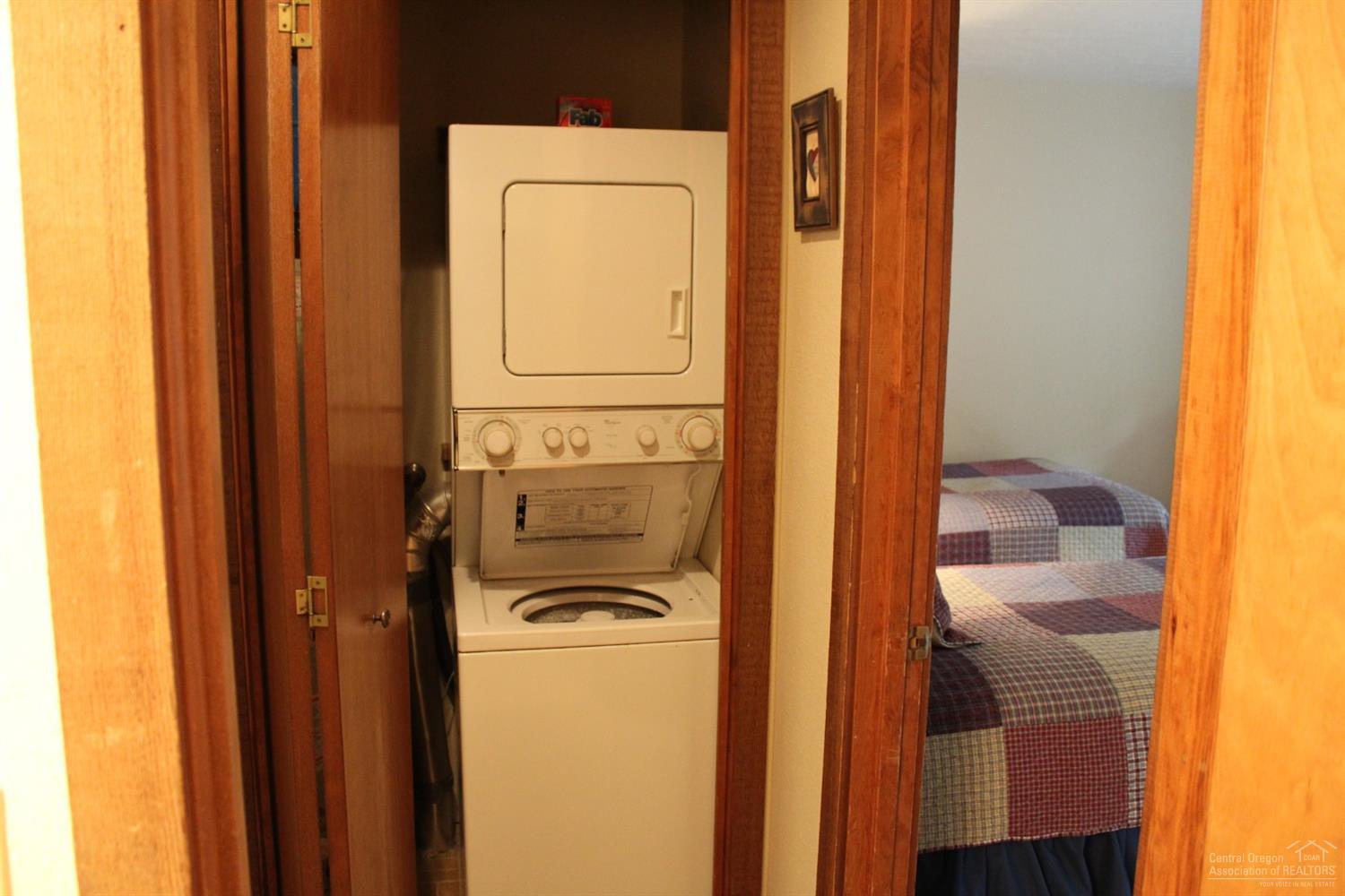 57328 Beaver Ridge Loop Sunriver, OR 97707 - Photo 12 of 22 a utility room with dryer and washer