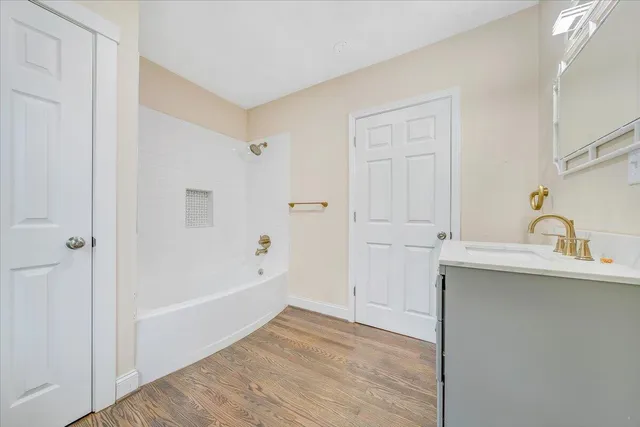 a bathroom with a bathtub and a sink