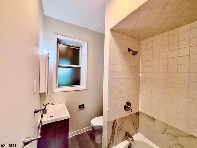 a bathroom with a sink and toilet