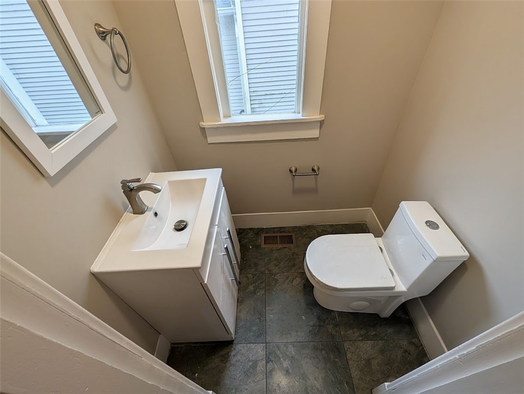 10796 Preble County Line Road Brookville, OH 45309 - Photo 14 of 33 This thoughtfully designed bathroom offers convenience and essential amenities for daily routines.
