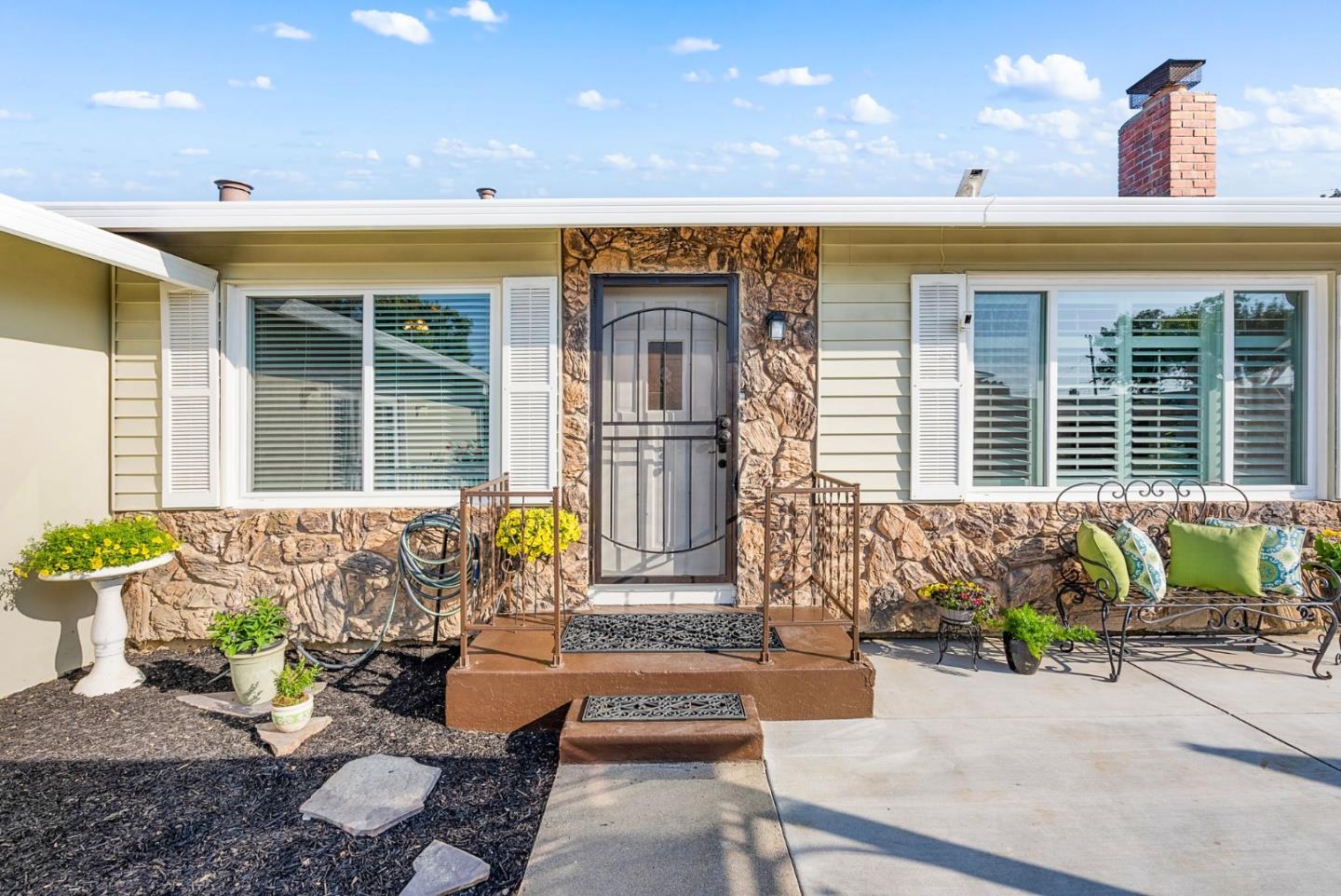 254 Uvas Street Milpitas, CA 95035 - Photo 13 of 48 a front view of a house with outdoor seating