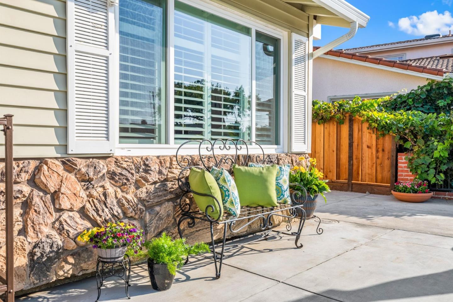 254 Uvas Street Milpitas, CA 95035 - Photo 14 of 48 a view of a chairs and table in a backyard