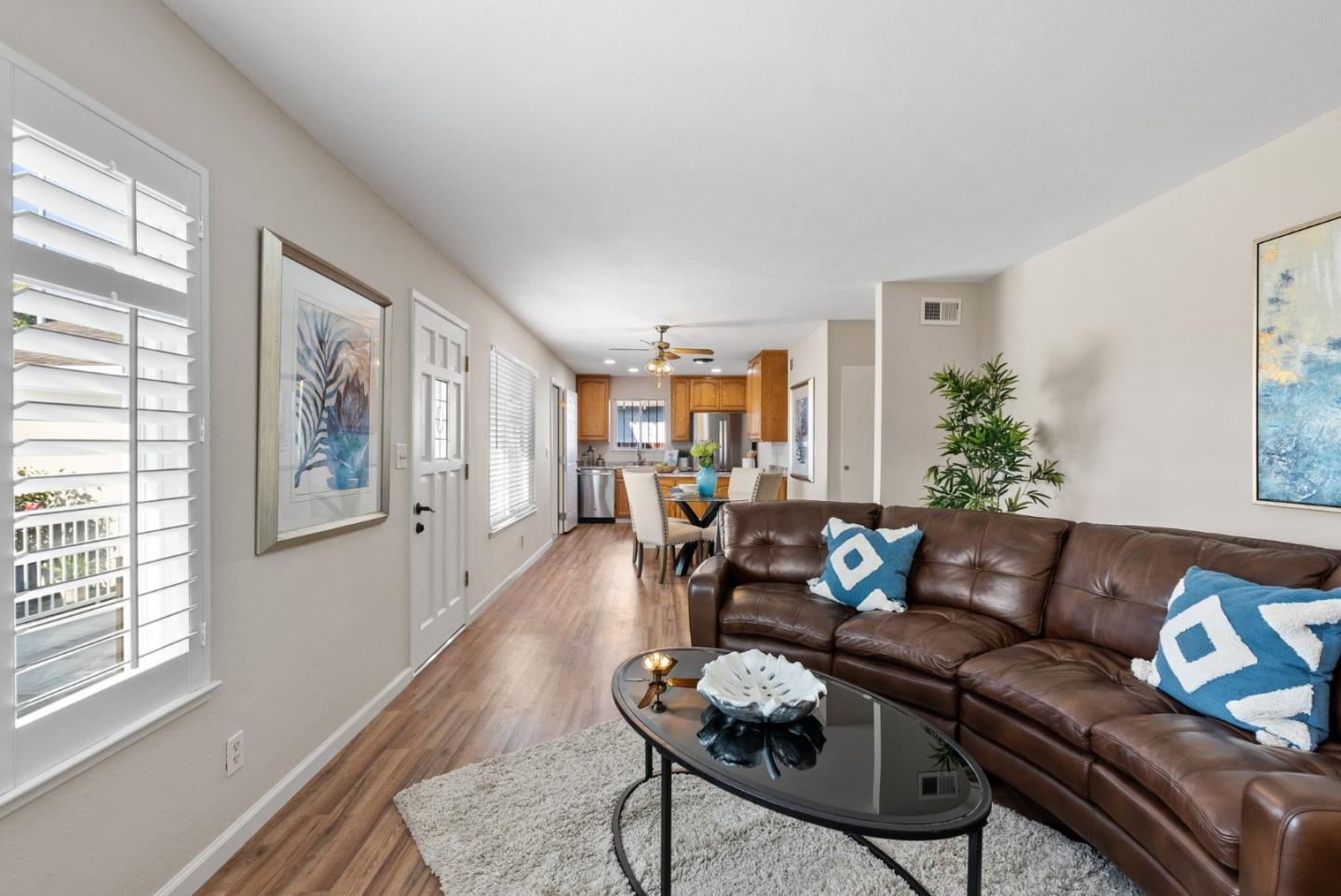 254 Uvas Street Milpitas, CA 95035 - Photo 18 of 48 a living room with furniture and wooden floor