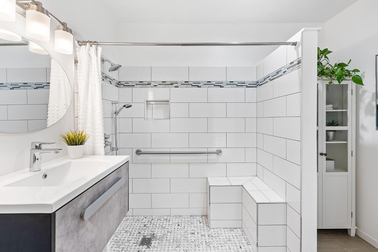 254 Uvas Street Milpitas, CA 95035 - Photo 29 of 48 a bathroom with a sink shower and a mirror