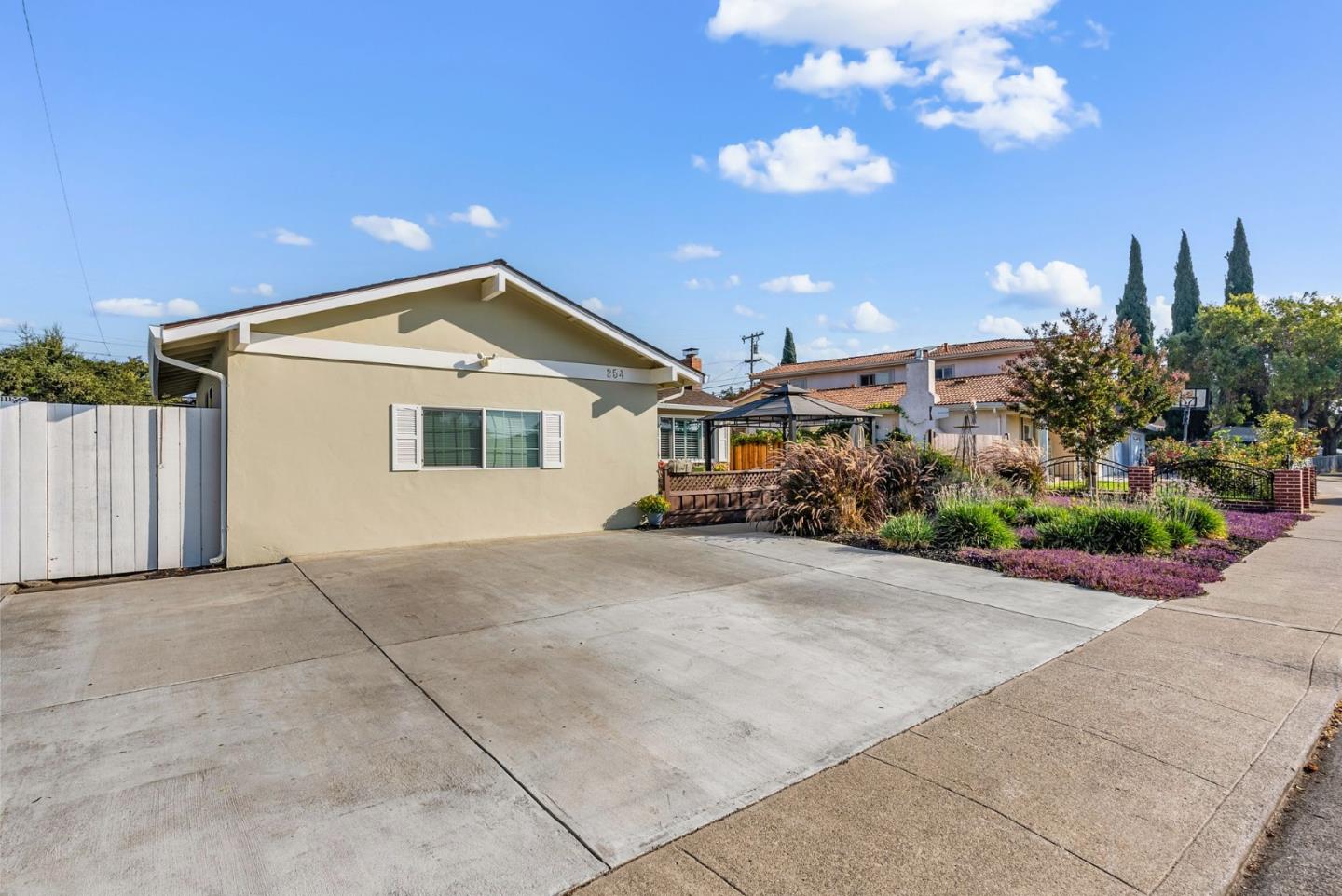 254 Uvas Street Milpitas, CA 95035 - Photo 3 of 48 a front view of a house with a yard