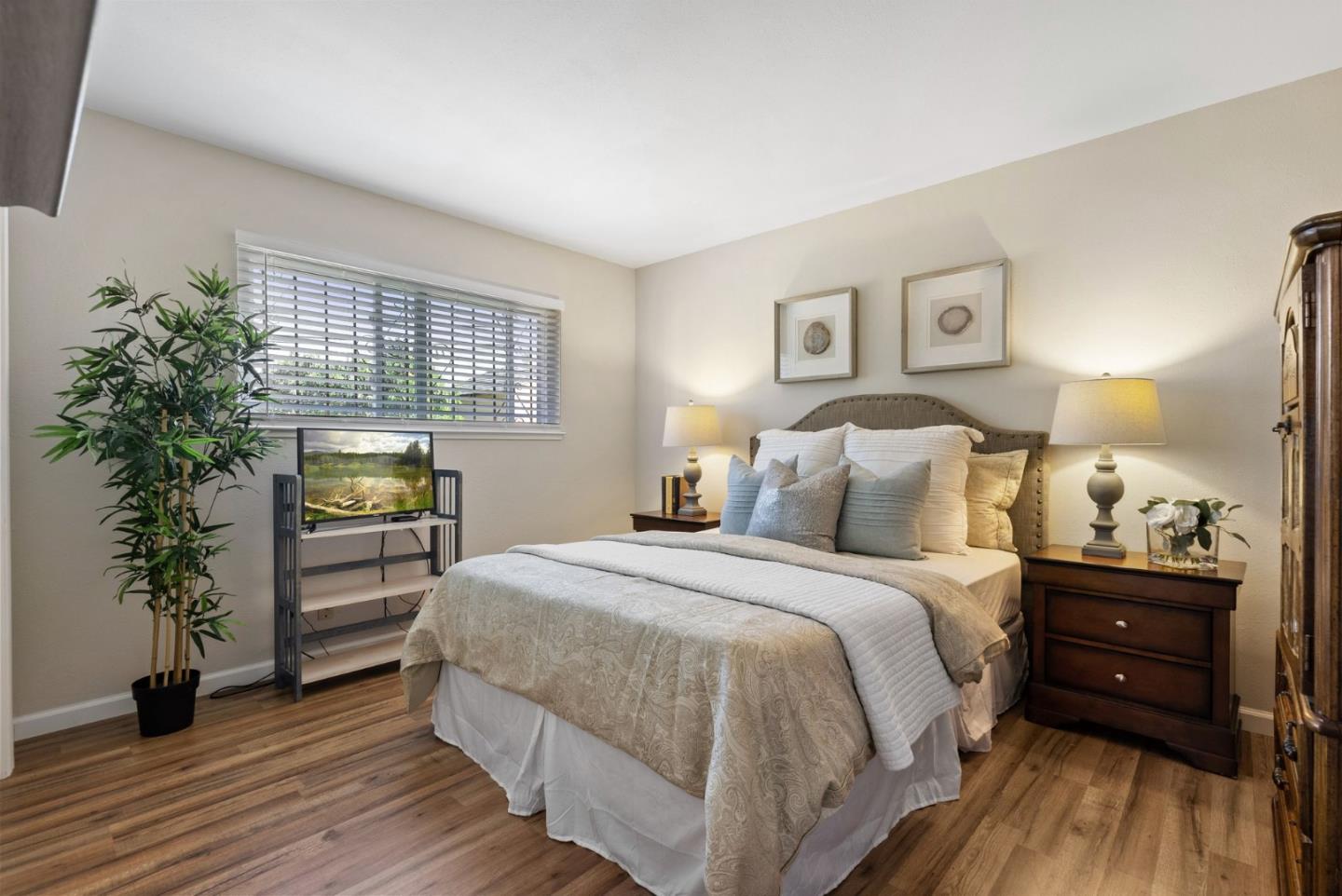 254 Uvas Street Milpitas, CA 95035 - Photo 31 of 48 a bedroom with a bed and a potted plant