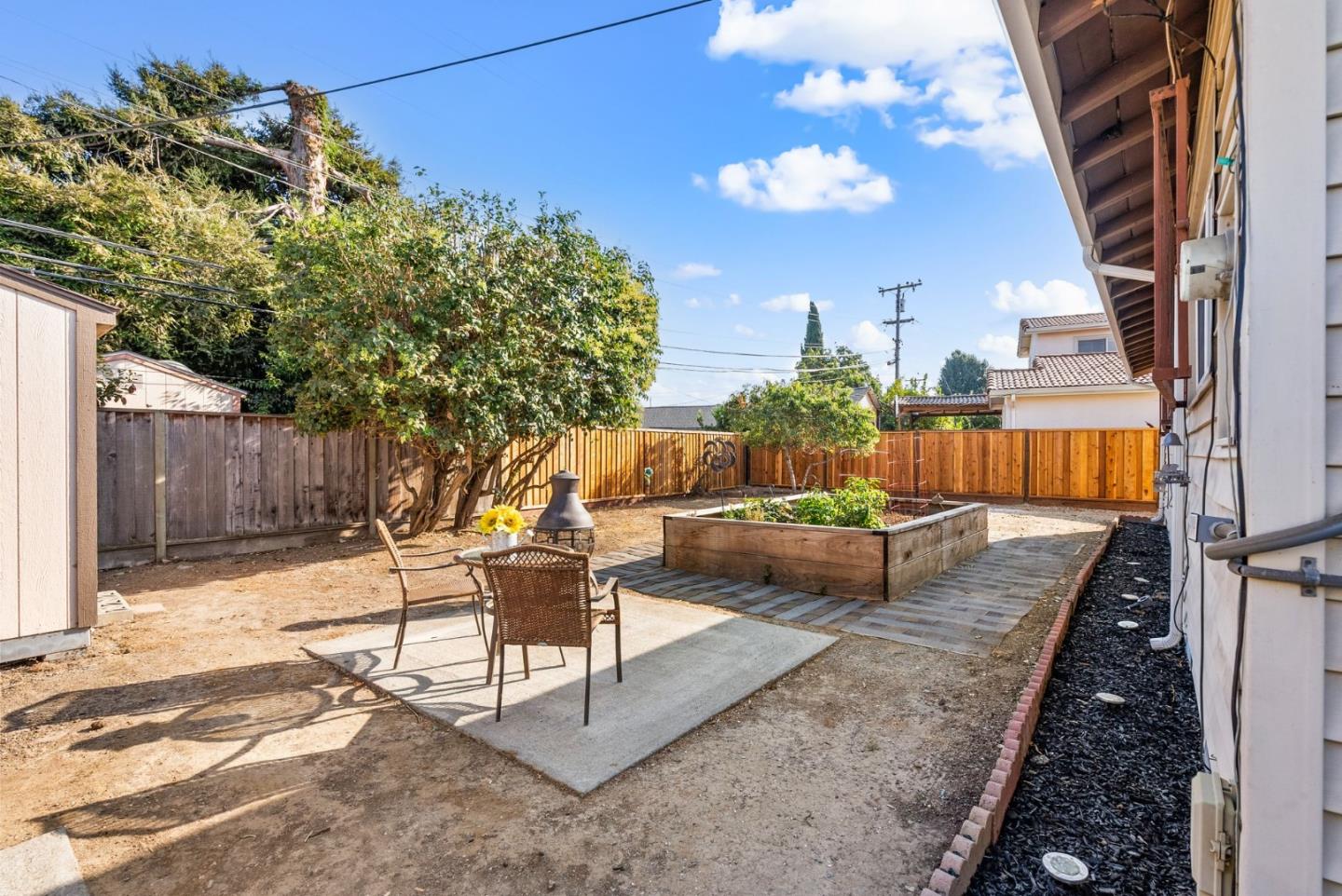 254 Uvas Street Milpitas, CA 95035 - Photo 36 of 48 a living room with furniture and a potted plant
