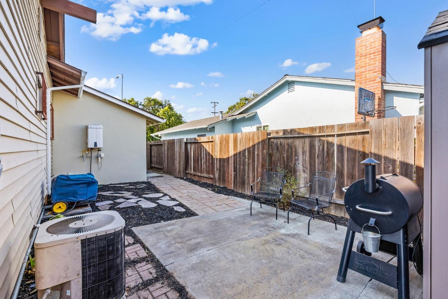 254 Uvas Street Milpitas, CA 95035 - Photo 39 of 48 a backyard of a house with table and chairs