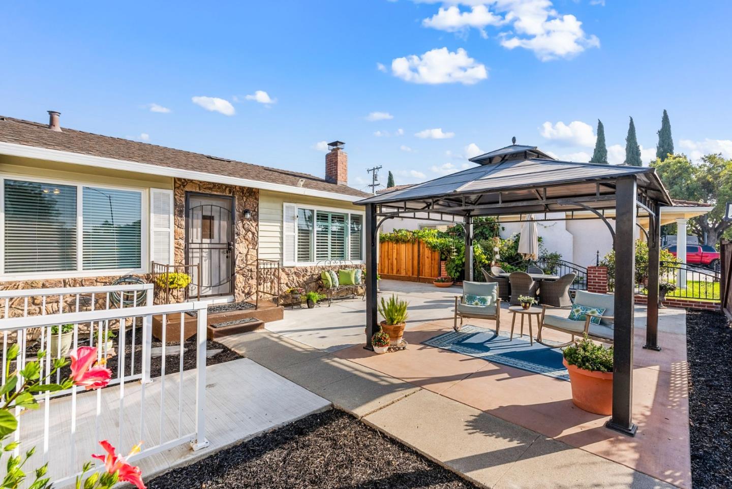 254 Uvas Street Milpitas, CA 95035 - Photo 5 of 48 a view of living room filled with furniture and a flat screen tv