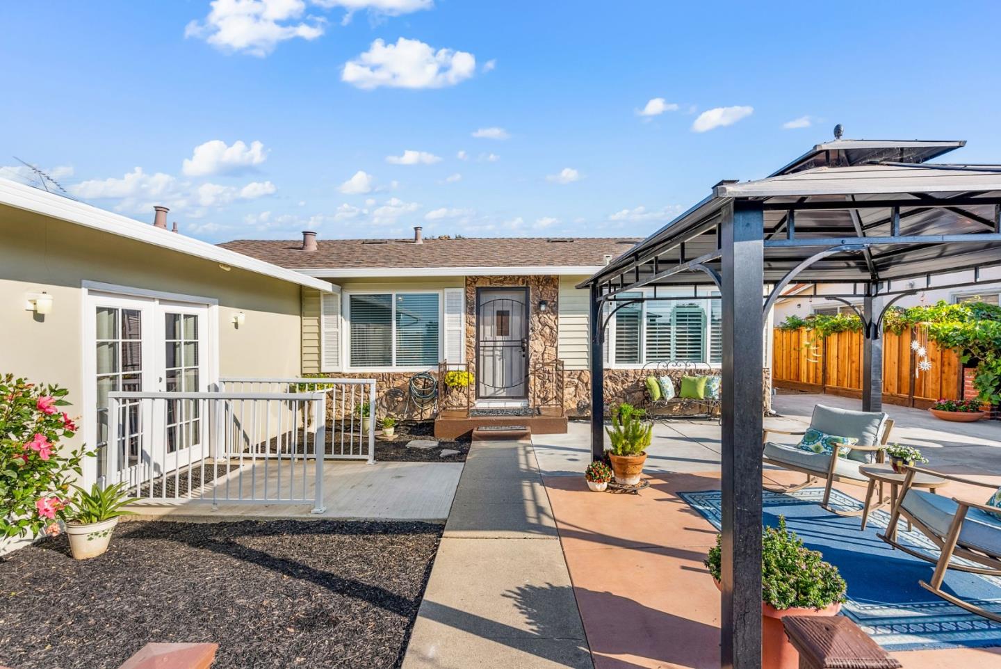 254 Uvas Street Milpitas, CA 95035 - Photo 6 of 48 a view of a patio with couches table and chairs and potted plants