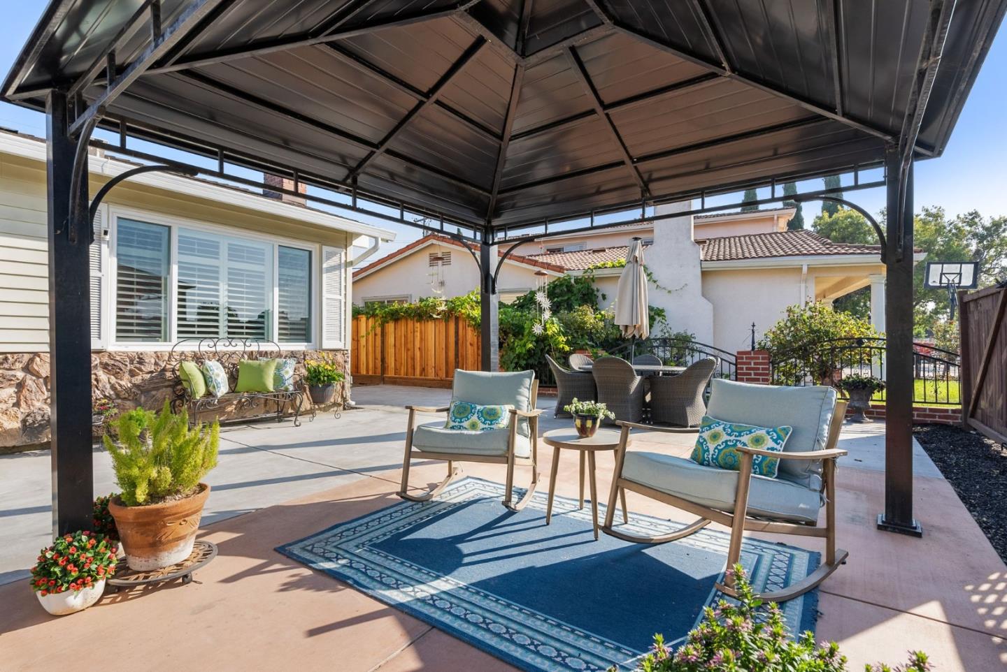 254 Uvas Street Milpitas, CA 95035 - Photo 10 of 48 a building outdoor space with patio furniture and potted plants