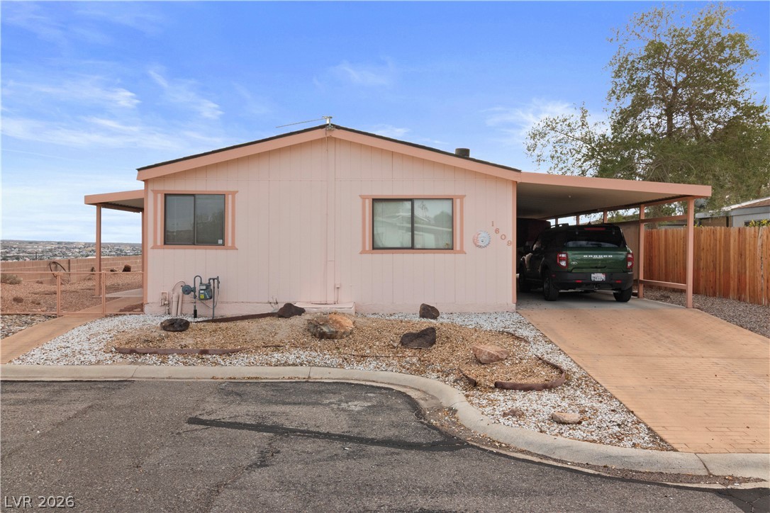 1609 Cajon Court Laughlin, NV 89029 - Photo 31 of 69 View of front facade with concrete driveway and an attached carport