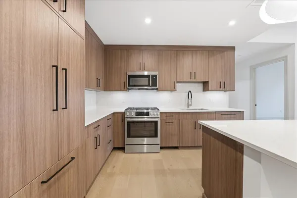 a view of kitchen with wooden floor
