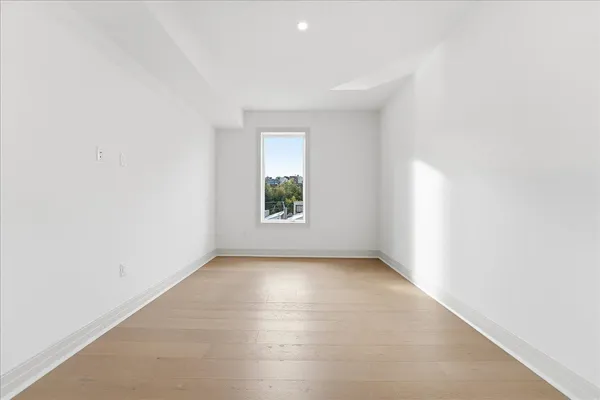 an empty room with windows and yard