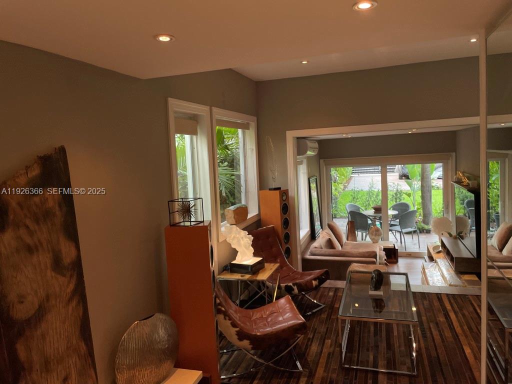 2654 Southwest 25th Terrace Miami, FL 33133 - Photo 11 of 36 a living room with furniture and a floor to ceiling window