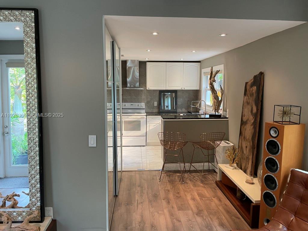 2654 Southwest 25th Terrace Miami, FL 33133 - Photo 12 of 36 a kitchen with stainless steel appliances granite countertop a refrigerator and a sink