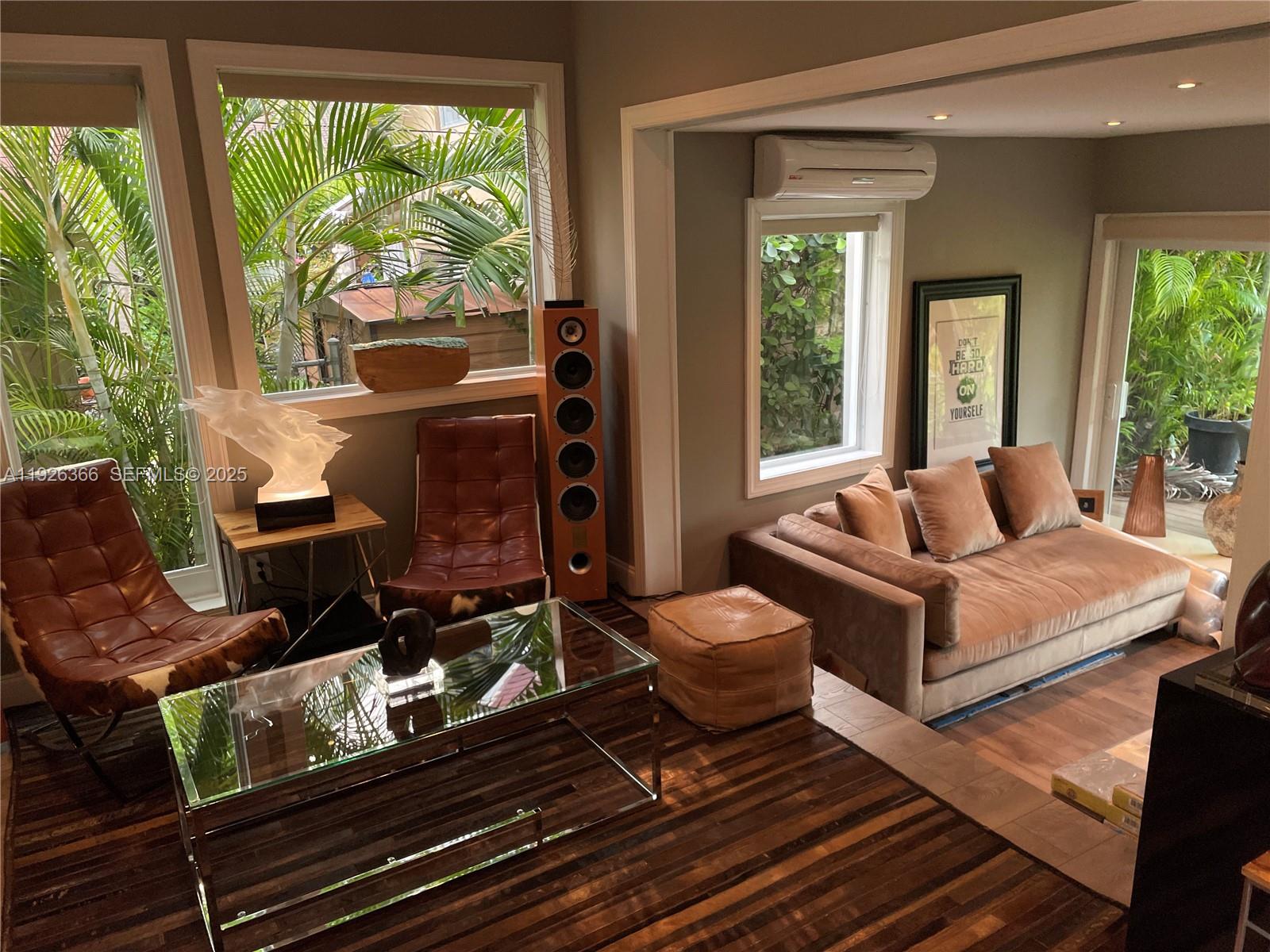 2654 Southwest 25th Terrace Miami, FL 33133 - Photo 17 of 36 a living room with furniture fireplace and large windows