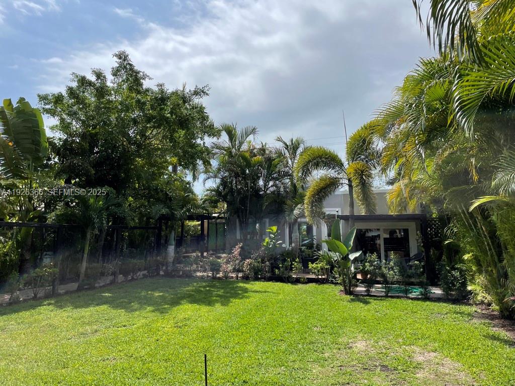 2654 Southwest 25th Terrace Miami, FL 33133 - Photo 2 of 36 a front view of a house with garden
