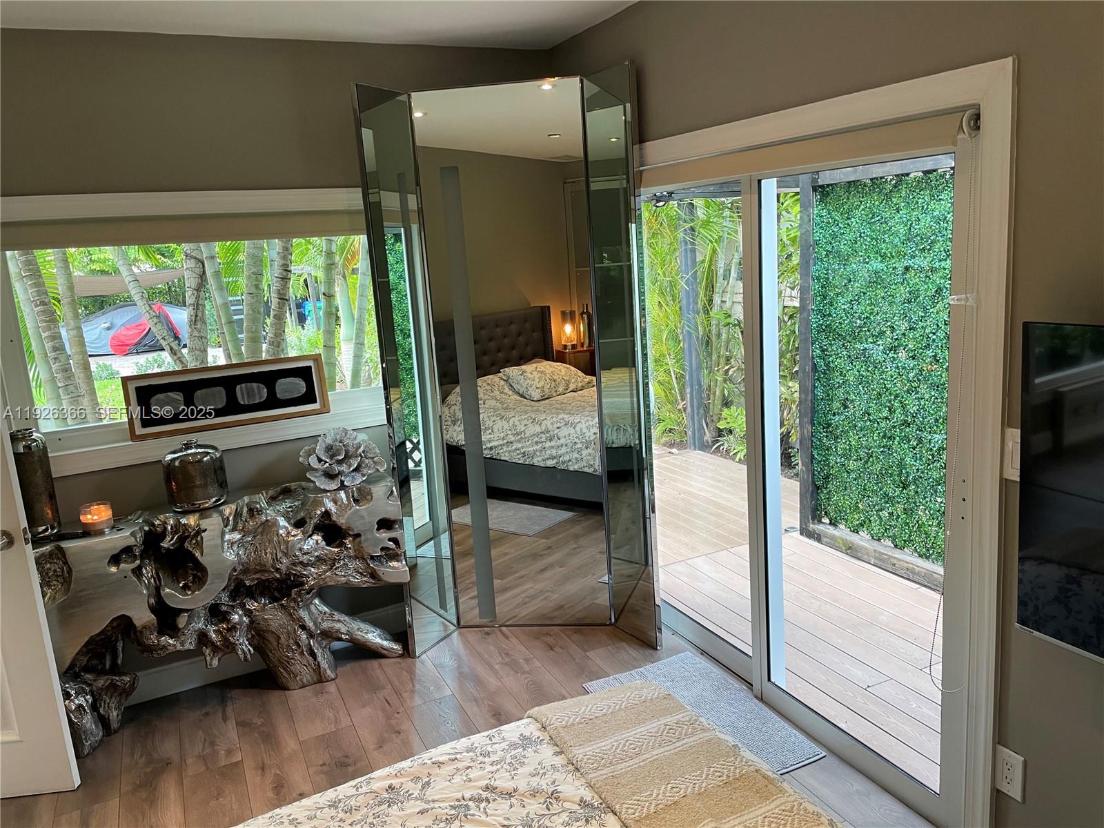 2654 Southwest 25th Terrace Miami, FL 33133 - Photo 21 of 36 a bedroom with furniture and a large window