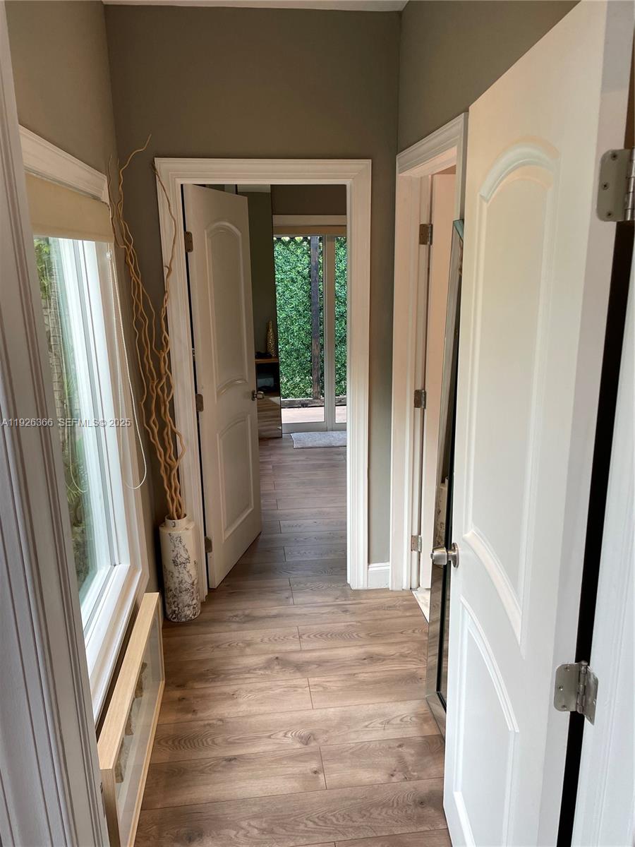 2654 Southwest 25th Terrace Miami, FL 33133 - Photo 25 of 36 a view of a hallway with wooden floor and stairs