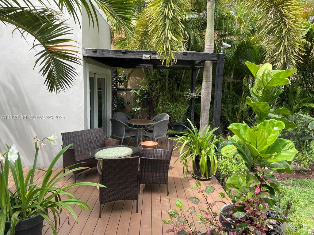 2654 Southwest 25th Terrace Miami, FL 33133 - Photo 29 of 36 a view of a patio with table and chairs and potted plants