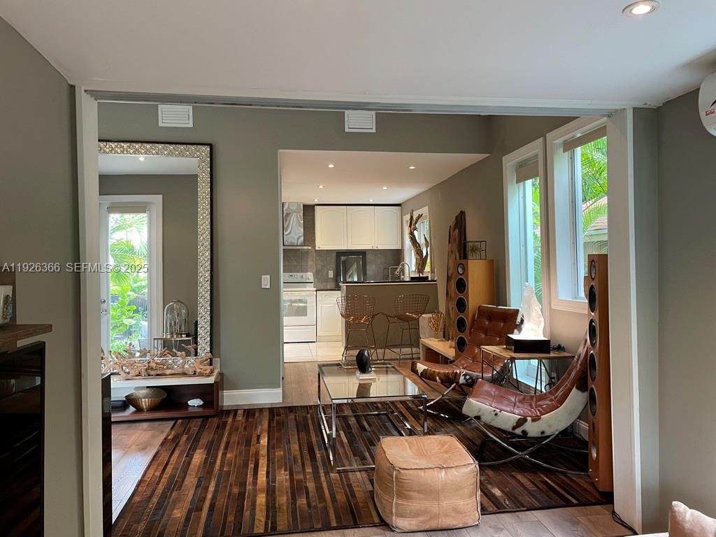 2654 Southwest 25th Terrace Miami, FL 33133 - Photo 3 of 36 a living room with furniture and a large window