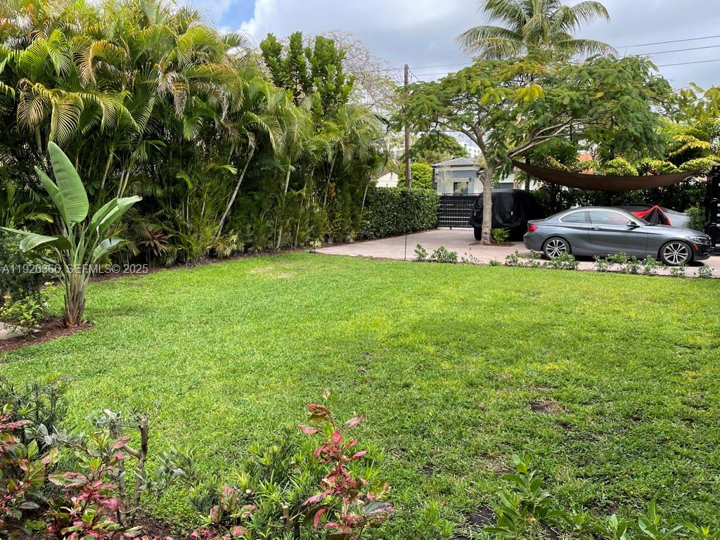 2654 Southwest 25th Terrace Miami, FL 33133 - Photo 34 of 36 a view of a house with a yard