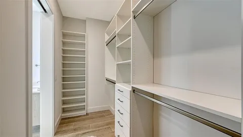 a view of walk in closet with stairs