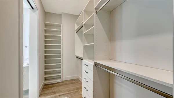 a view of walk in closet with stairs
