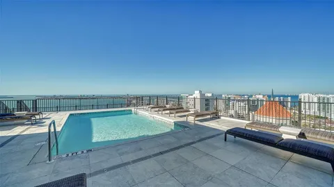 a terrace with outdoor seating and city view