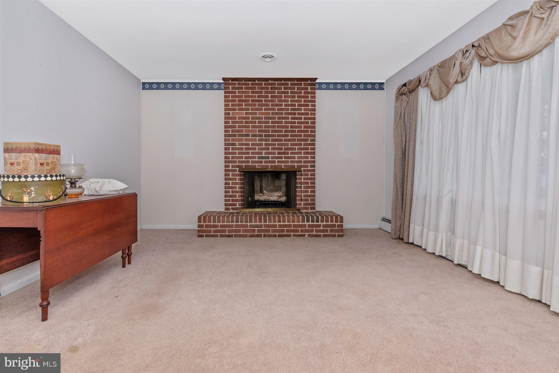 522 Key Heights Road Union Bridge, MD 21791 - Photo 22 of 54 a view of an empty room with a fireplace