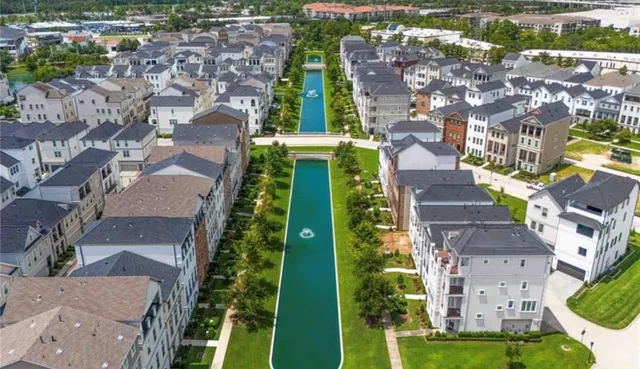 a living room with fireplace furniture and floor to ceiling window