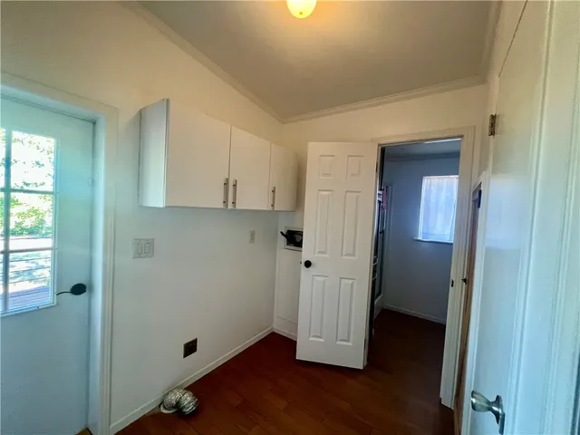 a view of a room with wooden floor and closet