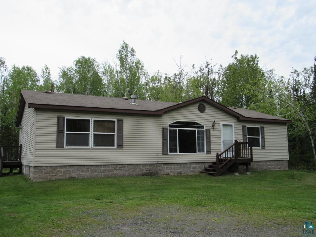 5243 East Neuman Road Superior, WI 54880 - Photo 2 of 35 Manufactured / mobile home featuring a front yard